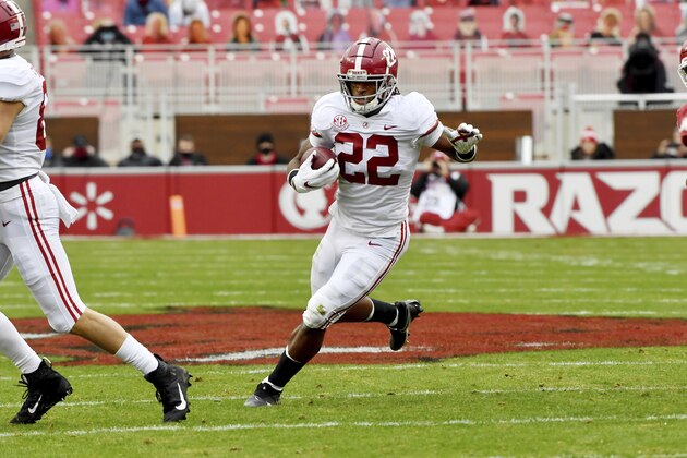 Alabama running back Najee Harris runs the ball against Arkansas during an NCAA college football game Saturday, Dec. 12, 2020, in Fayetteville, Ark. (AP Photo/Michael Woods)