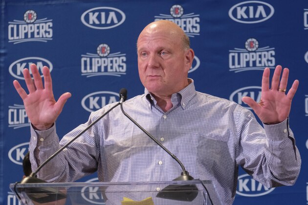 From left, Los Angeles Clippers team chairman Steve Ballmer introduces Paul George and Kawhi Leonard at a press conference at the Green Meadows Recreation Center in Los Angeles, Wednesday, July 23, 2019. (AP Photo/Ringo H.W. Chiu)