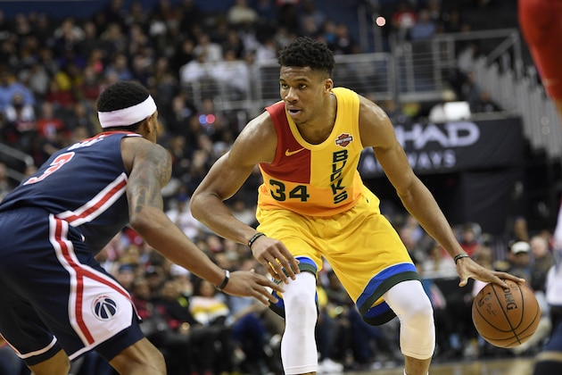 Milwaukee Bucks forward Giannis Antetokounmpo (34) dribbles the ball against Washington Wizards guard Bradley Beal (3) during the second half of an NBA basketball game, Saturday, Feb. 2, 2019, in Washington. The Bucks won 131-115. (AP Photo/Nick Wass)