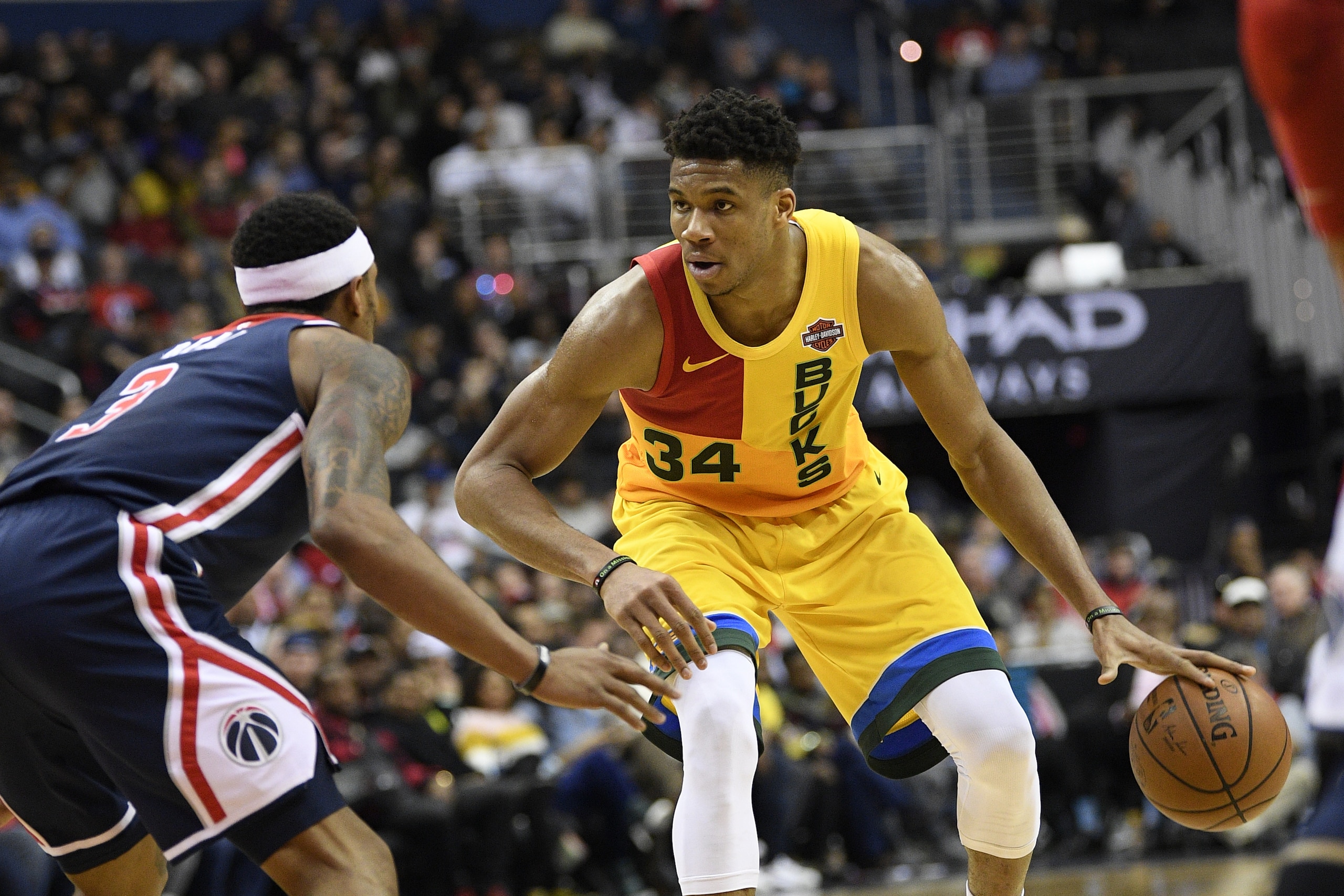 Milwaukee Bucks forward Giannis Antetokounmpo (34) dribbles the ball against Washington Wizards guard Bradley Beal (3) during the second half of an NBA basketball game, Saturday, Feb. 2, 2019, in Washington. The Bucks won 131-115. (AP Photo/Nick Wass)