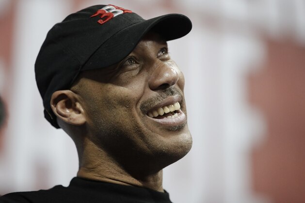 LaVar Ball, father of Los Angeles Lakers' Lonzo Ball, watches the Lakers play the Los Angeles Clippers during the second half of an NBA summer league basketball game, Friday, July 7, 2017, in Las Vegas. (AP Photo/John Locher)
