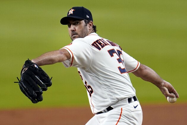 FILE- In this July 24, 2020, file photo, Houston Astros starting pitcher Justin Verlander throws against the Seattle Mariners during the first inning of a baseball game in Houston. The Astros announced Saturday, Sept. 19, 2020, that Verlander needs Tommy John surgery and could miss the entire 2021 season.  (AP Photo/David J. Phillip, File)