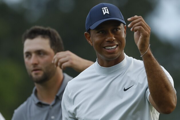 Tiger Woods smiles as he walks off the 18th green during the second round for the Masters golf tournament Friday, April 12, 2019, in Augusta, Ga. (AP Photo/Matt Slocum)