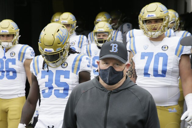 UCLA head coach Chip Kelly leads his team on the field before an NCAA college football game against Oregon, Saturday, Nov. 21, 2020, in Eugene, Ore. (AP Photo/Chris Pietsch)