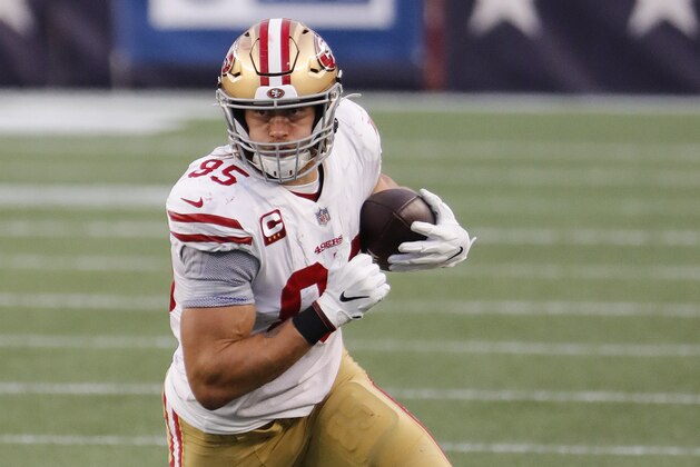 San Francisco 49ers tight end George Kittle runs the ball after a catch against the New England Patriots during an NFL football game at Gillette Stadium, Sunday, Oct. 25, 2020 in Foxborough, Mass. (Winslow Townson/AP Images for Panini) San Francisco 49ers tight end George Kittle runs the ball after a catch against the New England Patriots during an NFL football game at Gillette Stadium, Sunday, Oct. 25, 2020 in Foxborough, Mass. (Winslow Townson/AP Images for Panini)