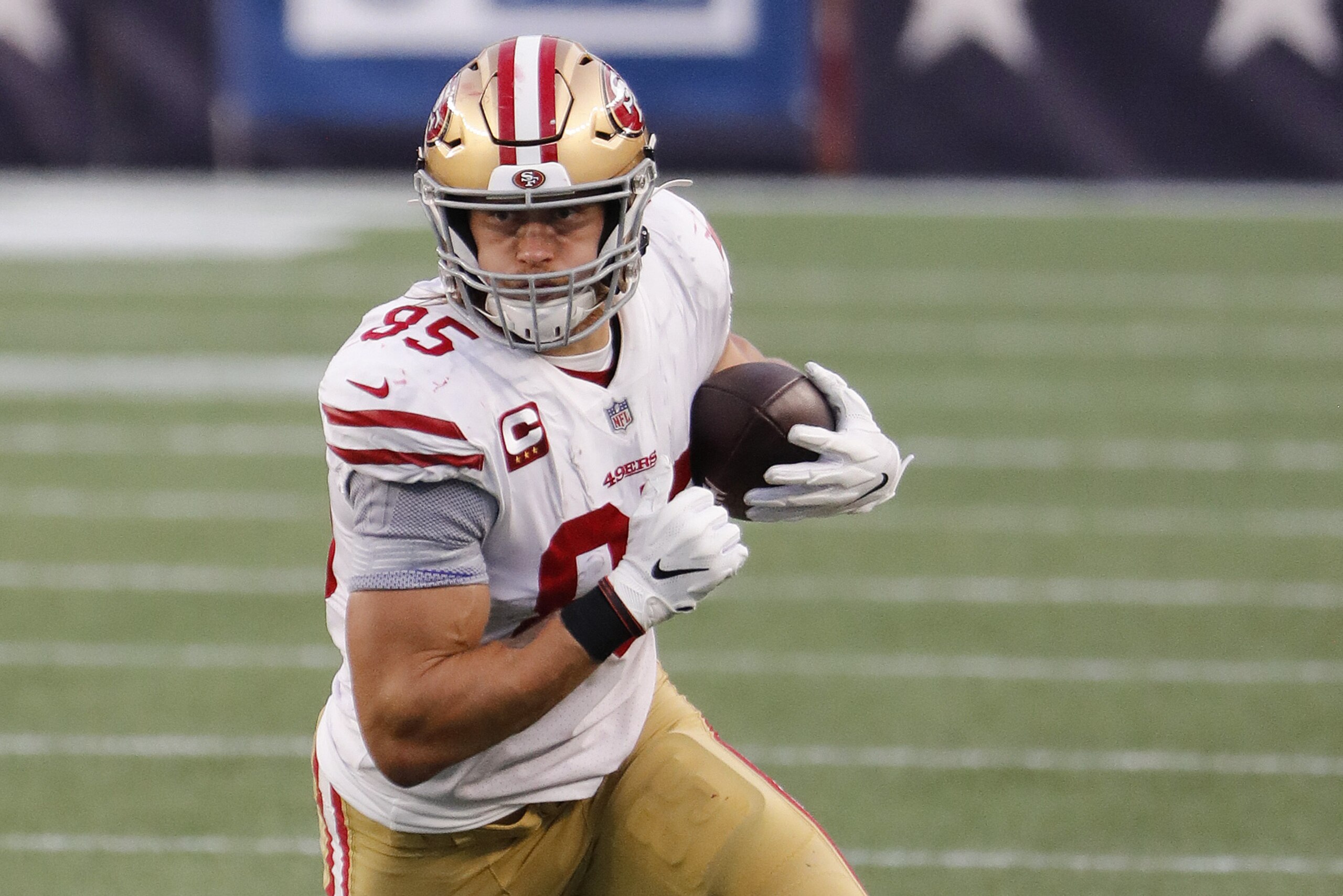 San Francisco 49ers tight end George Kittle runs the ball after a catch against the New England Patriots during an NFL football game at Gillette Stadium, Sunday, Oct. 25, 2020 in Foxborough, Mass. (Winslow Townson/AP Images for Panini)