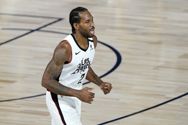 Los Angeles Clippers' Kawhi Leonard (2) reacts after making a three-point shot against the Dallas Mavericks during the second half of an NBA basketball game Thursday, Aug. 6, 2020 in Lake Buena Vista, Fla. The Clippers won 126-111. (AP Photo/Ashley Landis, Pool)