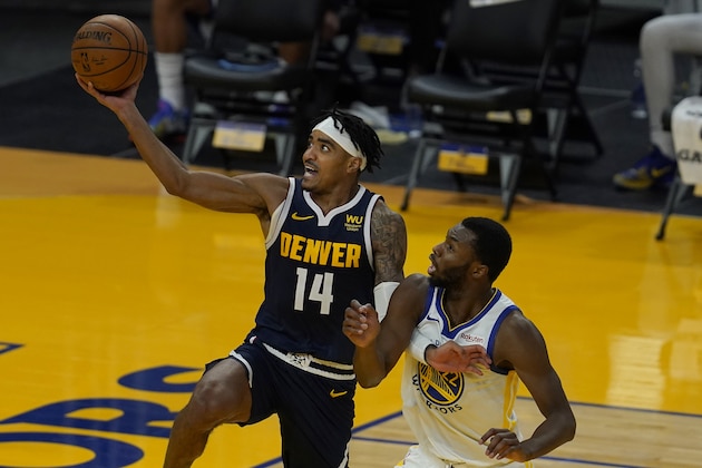 Denver Nuggets guard Gary Harris (14) shoots against Golden State Warriors forward Andrew Wiggins during the second half of a preseason NBA basketball game in San Francisco, Saturday, Dec. 12, 2020. (AP Photo/Jeff Chiu)