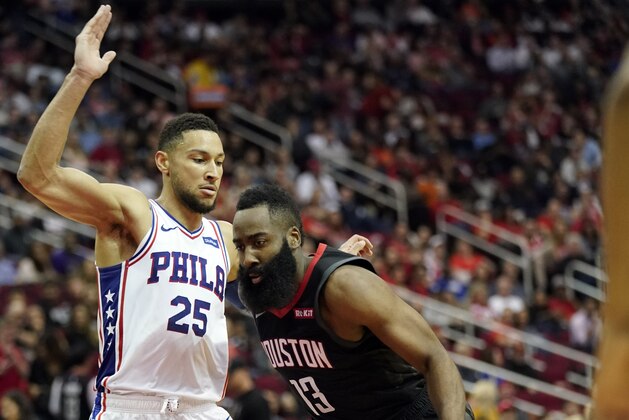 Houston Rockets' James Harden (13) drives toward the basket as Philadelphia 76ers' Ben Simmons (25) defends during the second half of an NBA basketball game Friday, March 8, 2019, in Houston. (AP Photo/David J. Phillip)