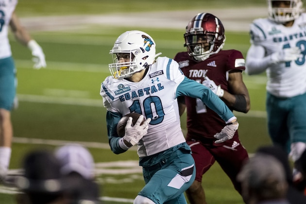 Coastal Carolina defensive back Alex Spillum (10) runs back an interception against Troy during the second half of an NCAA college football game, Saturday, Dec. 12, 2020, in Troy, Ala. (AP Photo/Vasha Hunt)