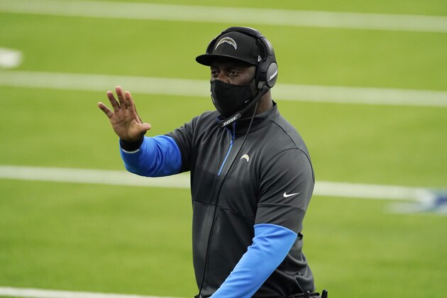 Los Angeles Chargers head coach Anthony Lynn signals from the sideline during the first half of an NFL football game against the Atlanta Falcons Sunday, Dec. 13, 2020, in Inglewood, Calif. (AP Photo/Ashley Landis)