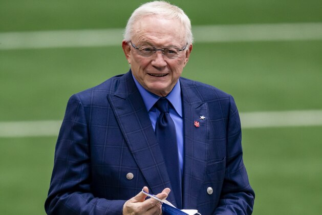 Dallas Cowboys owner Jerry Jones puts on a mask before an NFL football game against the Pittsburgh Steelers, Sunday, Nov. 8, 2020, in Arlington, Texas. Pittsburgh won 24-19. (AP Photo/Brandon Wade)