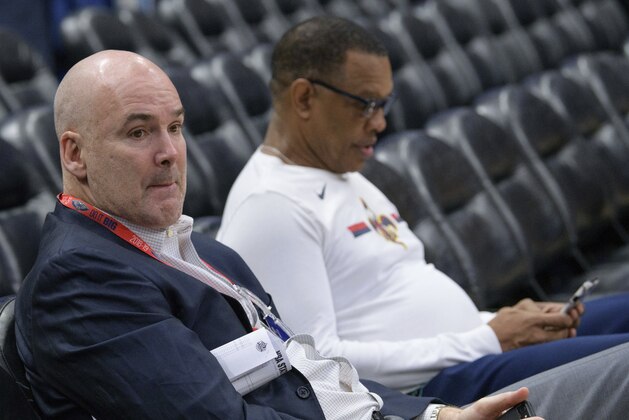 FILE - In this Feb. 23, 2019, file photo, New Orleans Pelicans interim general manager Danny Ferry, left, and coach Alvin Gentry watch players warm up for the team's NBA basketball game against the Los Angeles Lakers in New Orleans. A person familiar with the process says the Pelicans have begun interviewing candidates to become the club’s new general manager. The person says the list of candidates includes Ferry, as well as former Cleveland Cavaliers general manager David Griffin, Golden State assistant GM Larry Harris, Brooklyn Nets assistant GM Trajan Langon, Houston Rockets assistant GM Gersson Rosas and interim Washington president of basketball operations Tommy Sheppard. (AP Photo/Matthew Hinton, File) FILE - In this Feb. 23, 2019, file photo, New Orleans Pelicans interim general manager Danny Ferry, left, and coach Alvin Gentry watch players warm up for the team's NBA basketball game against the Los Angeles Lakers in New Orleans. A person familiar with the process says the Pelicans have begun interviewing candidates to become the club’s new general manager. The person says the list of candidates includes Ferry, as well as former Cleveland Cavaliers general manager David Griffin, Golden State assistant GM Larry Harris, Brooklyn Nets assistant GM Trajan Langon, Houston Rockets assistant GM Gersson Rosas and interim Washington president of basketball operations Tommy Sheppard. (AP Photo/Matthew Hinton, File)