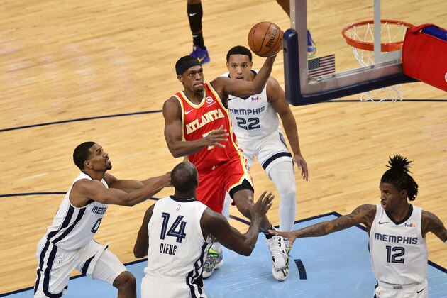 Atlanta Hawks guard Rajon Rondo (7) drives to the basket between Memphis Grizzlies center Gorgui Dieng (14) and guards De'Anthony Melton (0), Ja Morant (12) and Desmond Bane (22) in the second half of an NBA preseason basketball game Thursday, Dec. 17, 2020, in Memphis, Tenn. (AP Photo/Brandon Dill) Atlanta Hawks guard Rajon Rondo (7) drives to the basket between Memphis Grizzlies center Gorgui Dieng (14) and guards De'Anthony Melton (0), Ja Morant (12) and Desmond Bane (22) in the second half of an NBA preseason basketball game Thursday, Dec. 17, 2020, in Memphis, Tenn. (AP Photo/Brandon Dill)