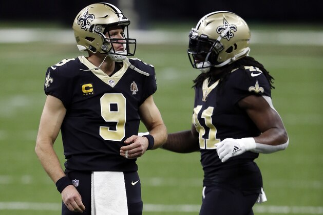 New Orleans Saints quarterback Drew Brees (9) and running back Alvin Kamara (41) during an NFL football game against the Carolina Panthers, Sunday, Oct. 25, 2020, in New Orleans. (AP Photo/Tyler Kaufman)