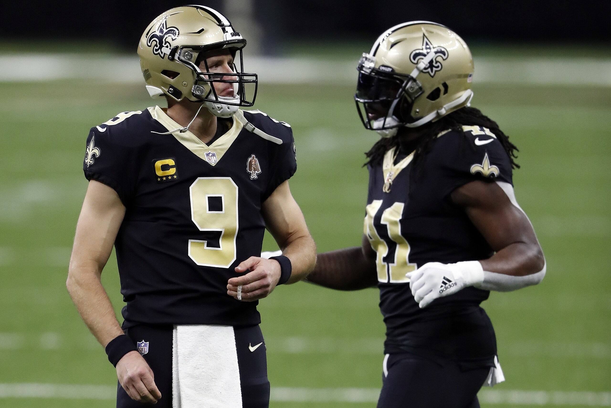 New Orleans Saints quarterback Drew Brees (9) and running back Alvin Kamara (41) during an NFL football game against the Carolina Panthers, Sunday, Oct. 25, 2020, in New Orleans. (AP Photo/Tyler Kaufman)