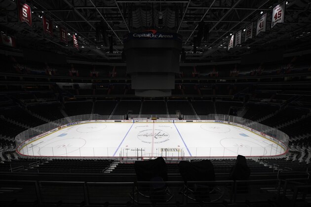 The Capital One Arena, home of the Washington Capitals NHL hockey club, sits empty Thursday, March 12, 2020, in Washington. The NHL is following the NBAâ€™s lead and suspending its season amid the coronavirus outbreak, the league announced Thursday. (AP Photo/Nick Wass)