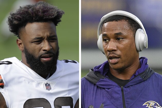 At left in a Dec. 6, 2020, photo, Cleveland Browns wide receiver Jarvis Landry warms up before an NFL football game against the Tennessee Titans in Nashville, Tenn. At right in a Sept. 28, 2020, photo, Baltimore Ravens cornerback Marcus Peters warms up before an NFL football game against the Kansas City Chiefs in Baltimore. Browns wide receiver Jarvis Landry called Ravens cornerback Marcus Peters “a coward” for appearing to spit at him during Monday night's, Dec. 14 game. A video taken from the national TV broadcast shows Peters spitting in Landry's direction at the end of the first quarter. (AP Photo)