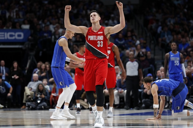 Portland Trail Blazers' Zach Collins (33) gestures after being charged with a foul during an NBA basketball game against the Dallas Mavericks in Dallas, Sunday, Oct. 27, 2019. (AP Photo/Tony Gutierrez)