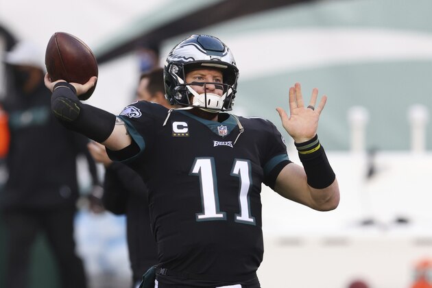 Philadelphia Eagles quarterbacks Carson Wentz (11) warms up before an NFL football game against the New Orleans Saints, Sunday, Dec. 13, 2020, in Philadelphia. (AP Photo/Rich Schultz)
