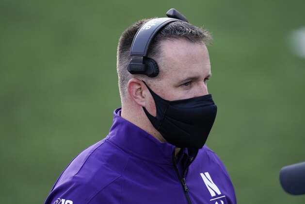 Northwestern head coach Pat Fitzgerald walks on the sideline during the second half of an NCAA college football game against Iowa, Saturday, Oct. 31, 2020, in Iowa City, Iowa. (AP Photo/Charlie Neibergall) Northwestern head coach Pat Fitzgerald walks on the sideline during the second half of an NCAA college football game against Iowa, Saturday, Oct. 31, 2020, in Iowa City, Iowa. (AP Photo/Charlie Neibergall)