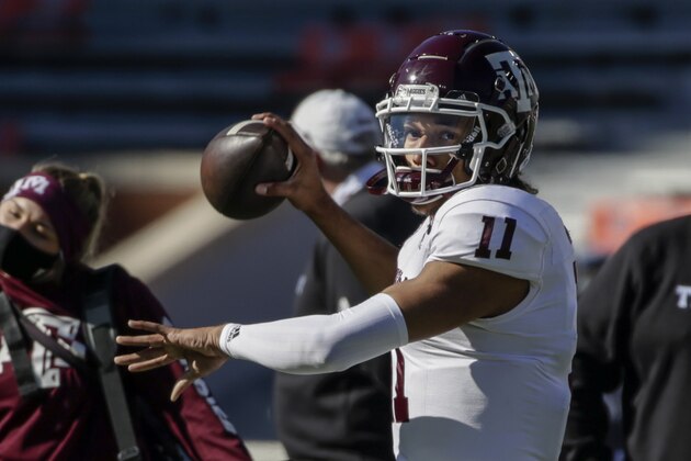 Texas A&M quarterback Kellen Mond (11) warms up before the first half of an NCAA college football game on Saturday, Dec. 5, 2020, in Auburn, Ala. (AP Photo/Butch Dill)