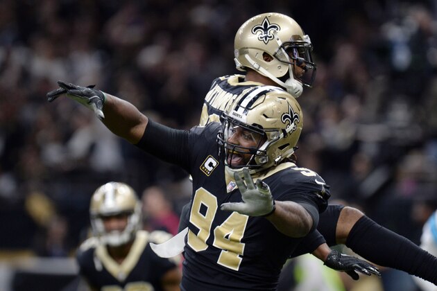 FILE - In this Jan. 7, 2018, file photo, New Orleans Saints defensive end Cameron Jordan (94) celebrates a defensive stop in the second half of an NFL football game against the Carolina Panthers, in New Orleans. Newly named All-Pro for the first time, Saints defensive Cam Jordan takes his playful yet menacing presence this weekend to the city where his father became a Pro Bowl tight end.  (AP Photo/Bill Feig, File)