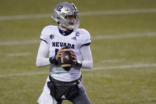 Nevada quarterback Carson Strong (12) plays against San Jose State during an NCAA college football game Friday, Dec. 11, 2020, in Las Vegas. (AP Photo/John Locher)