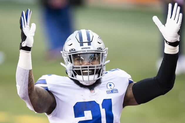 Dallas Cowboys running back Ezekiel Elliott (21) reacts to fans after an NFL football game against the Cincinnati Bengals, Sunday, Dec. 13, 2020, in Cincinnati. (AP Photo/Emilee Chinn)