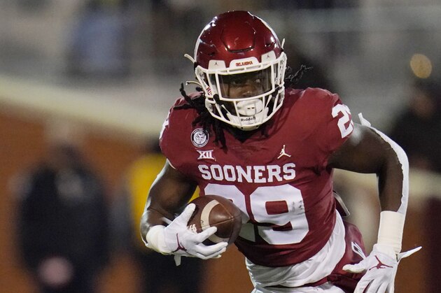 Oklahoma running back Rhamondre Stevenson (29) carries during an NCAA college football game against Baylor Saturday, Dec. 5, 2020, in Norman, Okla. (AP Photo/Sue Ogrocki)