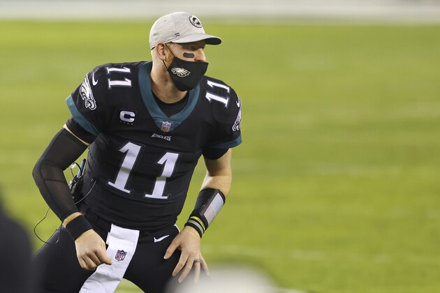 Philadelphia Eagles' Carson Wentz (11) warms up during an NFL football game against the New Orleans Saints, Sunday, Dec. 13, 2020, in Philadelphia. (AP Photo/Rich Schultz)