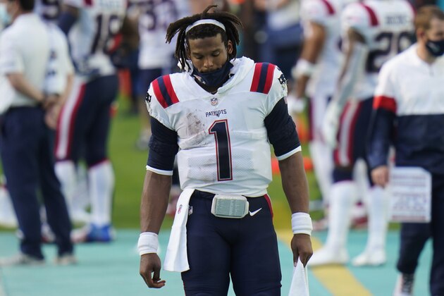 New England Patriots quarterback Cam Newton walks on the sidelines during the first half of an NFL football game against the Miami Dolphins Sunday, Dec. 20, 2020, in Tampa, Fla. The Dolphins defeated the Patriots 22-12. (AP Photo/Chris O'Meara)