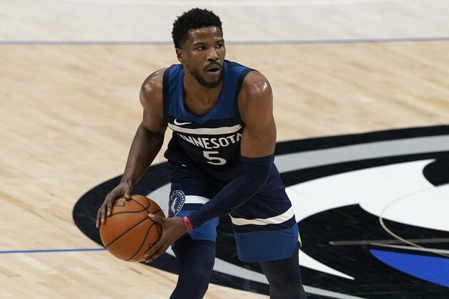 Minnesota Timberwolves' Malik Beasley (5) handles the ball during an NBA preseason basketball game against the Dallas Mavericks in Dallas, Thursday, Dec. 17, 2020. (AP Photo/Tony Gutierrez)