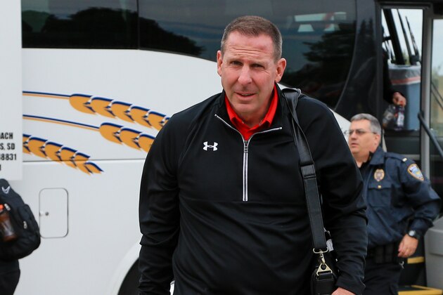 Youngstown State head coach Bo Pelini arrives at the Dakotadome before an NCAA college football game against South Dakota, in Vermillion, S.D., Saturday, Oct. 3, 2015. Vermillion lies seven miles north of the Nebraska state line, an area deep within the Huskers’ sphere of influence, and fans were lying in wait. They haven’t forgotten Pelini’s signature sideline meltdowns, his dour demeanor and the leaked audio recordings of him ripping the fans and using vulgarities to describe the athletic director in his final meeting with players. (AP Photo/Nati Harnik)