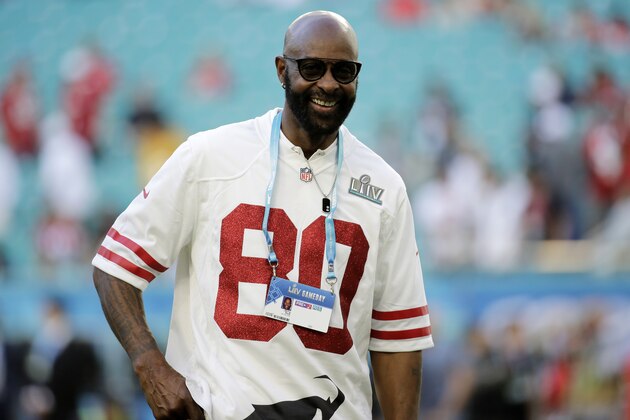 Former NFL player Jerry Rice walks on the field before the NFL Super Bowl 54 football game between the San Francisco 49ers and Kansas City Chiefs, Sunday, Feb. 2, 2020, in Miami Gardens, Fla. (AP Photo/Patrick Semansky)