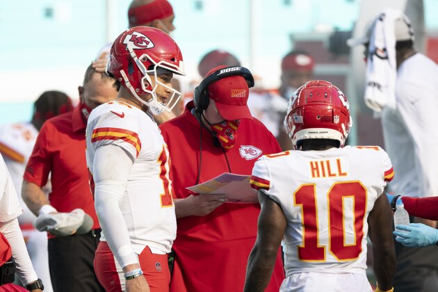 Kansas City Chiefs quarterback Patrick Mahomes (15) talks with Kansas City Chiefs head coach Andy Reid and Kansas City Chiefs wide receiver Tyreek Hill (10) on the sidelines as the Chiefs take on the Miami Dolphins during an NFL football game, Sunday, DEC. 13, 2020, in Miami Gardens, Fla. (AP Photo/Doug Murray)