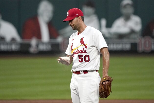 St. Louis Cardinals starting pitcher Adam Wainwright pauses on the mound during the second inning of a baseball game against the Kansas City Royals Tuesday, Aug. 25, 2020, in St. Louis. (AP Photo/Jeff Roberson)