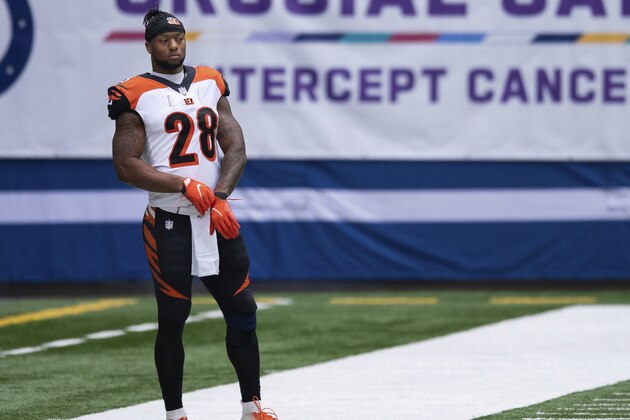 Cincinnati Bengals running back Joe Mixon (28) watches from the sidelines during an NFL football game between the Indianapolis Colts and Cincinnati Bengals, Sunday, Oct. 18, 2020, in Indianapolis. (AP Photo/Zach Bolinger)