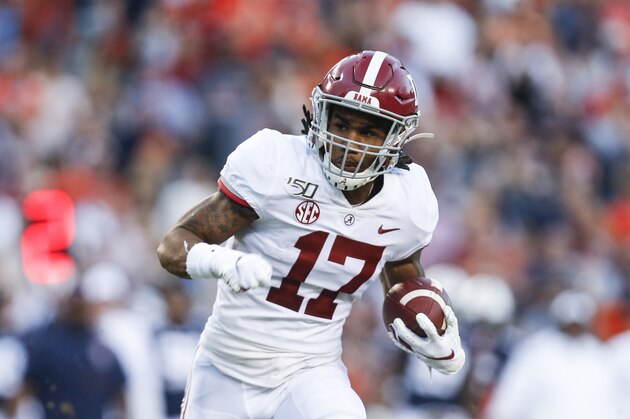 Alabama wide receiver Jaylen Waddle (17) carries the ball against Auburn during an NCAA college football game Saturday, Nov. 30, 2019, in Auburn, Ala. (AP Photo/Butch Dill) Alabama wide receiver Jaylen Waddle (17) carries the ball against Auburn during an NCAA college football game Saturday, Nov. 30, 2019, in Auburn, Ala. (AP Photo/Butch Dill)