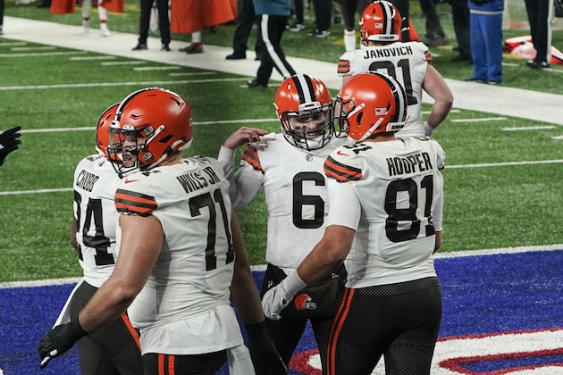 Cleveland Browns quarterback Baker Mayfield (6) celebrates with teammate Austin Hooper (81) after they connect for a touchdown during the first half of an NFL football game against the New York Giants, Sunday, Dec. 20, 2020, in East Rutherford, N.J. (AP Photo/Seth Wenig)