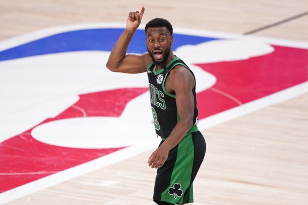Boston Celtics' Kemba Walker (8) reacts to a play against the Miami Heat during the second half of an NBA conference final playoff basketball game Friday, Sept. 25, 2020, in Lake Buena Vista, Fla. The Celtics won 121-108. (AP Photo/Mark J. Terrill)