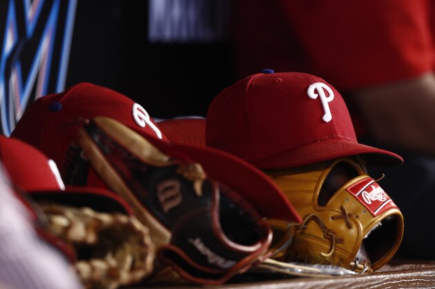 Philadelphia Phillies players hats and baseball gloves sit in the dugout during a baseball game against the Miami Marlins on Sunday, June 30, 2019, in Miami. (Brynn Anderson)