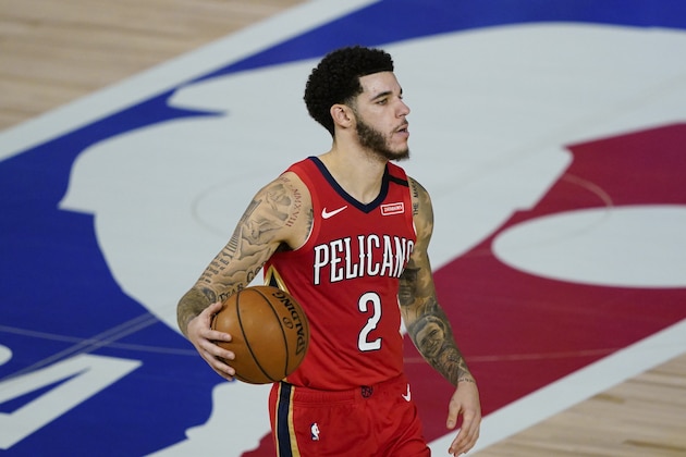New Orleans Pelicans' Lonzo Ball (2) makes his way down the court during an NBA basketball game against the Memphis Grizzlies Monday, Aug. 3, 2020, in Lake Buena Vista, Fla. (AP Photo/Ashley Landis, Pool)