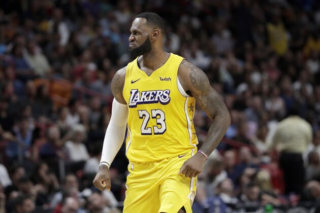 Los Angeles Lakers forward LeBron James (23) reacts during the second half of an NBA basketball game against the Miami Heat, Friday, Dec. 13, 2019, in Miami. The Lakers won 113-110. (AP Photo/Lynne Sladky)