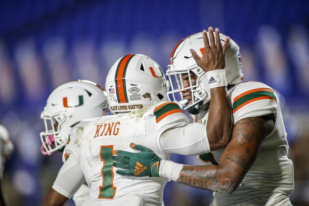 Miami quarterback D'Eriq King (1) celebrates with tight end Brevin Jordan (11) after they connected for a touchdown pass against Duke during the first quarter of an NCAA college football game Saturday, Dec. 5, 2020, in Durham, N.C. (Nell Redmond/Pool Photo via AP)