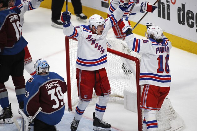 New York Rangers right wing Pavel Buchnevich celebrates his tying goal with left wing Artemi Panarin against Colorado Avalanche goaltender Pavel Francouz, left, in the final minute of the third period overtime of an NHL hockey game Wednesday, March 11, 2020, in Denver. Colorado won 3-2 in overtime. (AP Photo/David Zalubowski) New York Rangers right wing Pavel Buchnevich celebrates his tying goal with left wing Artemi Panarin against Colorado Avalanche goaltender Pavel Francouz, left, in the final minute of the third period overtime of an NHL hockey game Wednesday, March 11, 2020, in Denver. Colorado won 3-2 in overtime. (AP Photo/David Zalubowski)