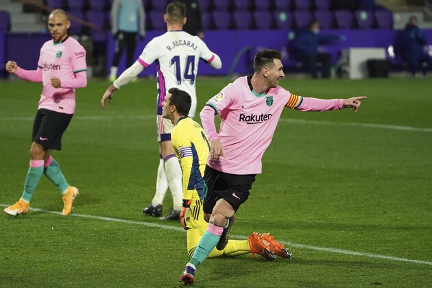 Barcelona's Lionel Messi celebrates after scoring his side's third goal during a Spanish La Liga soccer match between Valladolid and Barcelona at the Jose Zorrilla stadium in Valladolid, Spain,Tuesday Dec. 22, 2020. (Cesar Manso/Pool via AP)