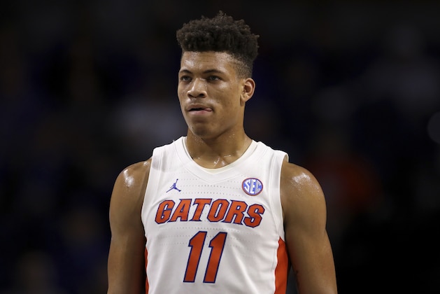 FILE - In this Nov. 29, 2019, file photo, Florida forward Keyontae Johnson (11) looks on during during the first half of an NCAA college basketball game against Marshall in Gainesville, Fla.  Johnson, the Southeastern Conference's preseason player of the year, collapsed coming out of a timeout against rival Florida State and needed emergency medical attention Saturday, Dec. 1`2, 2020. He was taken off the floor on a stretcher and rushed to Tallahassee Memorial for evaluation. The Gators had no immediate update on his condition. (AP Photo/Matt Stamey, File)
