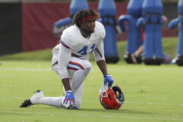 Florida Gators linebacker James Houston IV (41) rests on the field during an NCAA college football practice on Thursday, Dec. 26, 2019, in Miami Shores, Fla. Florida plays Virginia in the Orange Bowl on Dec. 30. (AP Photo/Mario Houben)