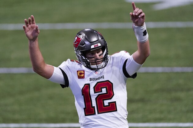 Tampa Bay Buccaneers quarterback Tom Brady (12) reacts after a Tampa Bay Buccaneers touchdown against the Atlanta Falcons during the second half of an NFL football game, Sunday, Dec. 20, 2020, in Atlanta. (AP Photo/John Bazemore)